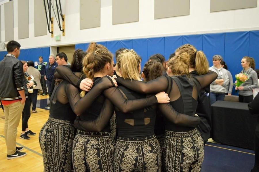 The team circling up before the performance on January 31st at Bonney Lake.