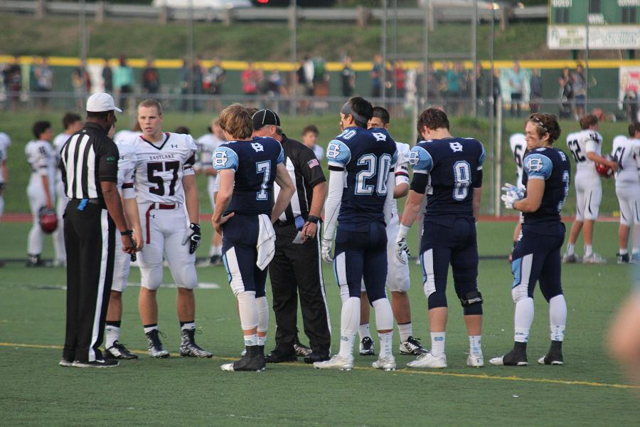 Captains of the Tides meet  at the beginning of the game with the Eastlake captains. The Tides won this game 40-6.