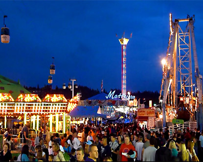 Washington State Fair at night, illuminated by the ride lights. Image obtained from “Washington State Fair.” Destination 360, Destination 360, www.destination360.com/north-america/us/washington/washington-state-fair.