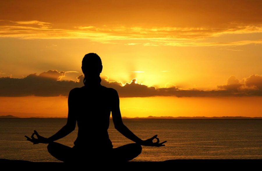 Yoga is a great way to reduce stress on campus. Image obtained from http://yogabeginnersguide.com.
