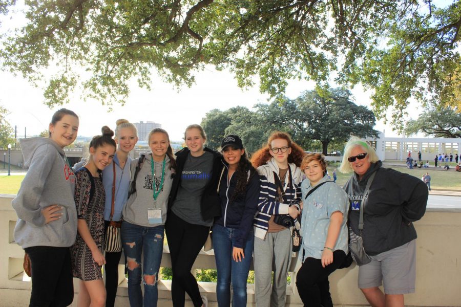 2017-18 yearbook and newspaper staff enjoy sightseeing in Dallas after competing in the fall annual JEA and NSPA journalism competition. Names listed from left to right: Ashleigh Johnson, Katherine Wallace, Claire Willis, Hadley Olson, Chelsea Bagwell, Ciara Greene, Alex Blashwood, Kai Cole, and Mrs. Robin Smith. Image taken by yearbook and newspaper advisor, Mr. Roland Smith.
