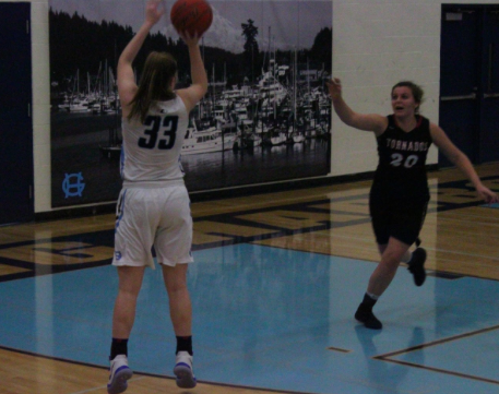 Maddie Wilett shoots a three-pointer against Yelm. Photo provided by Claire Willis.