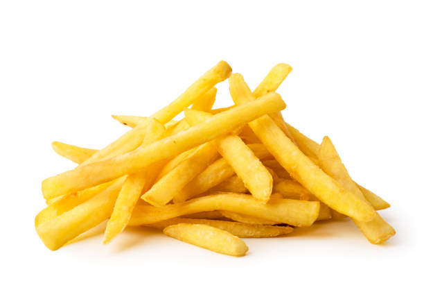 A bunch of fried French fries on a white background, close-up. Isolated.